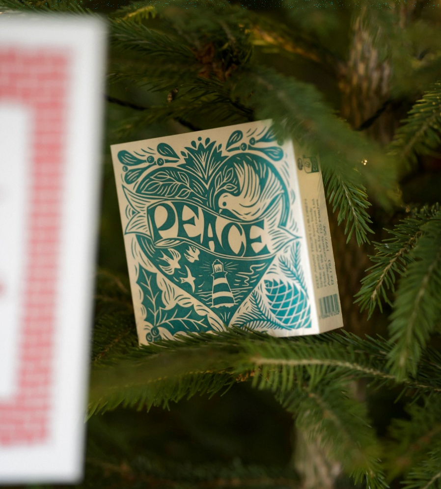 Card with 'PEACE' design on a Christmas tree